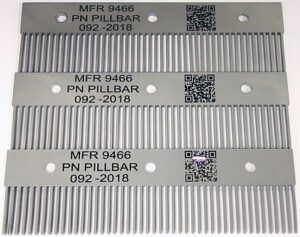 A set of four metal combs with qr codes on them.