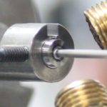 Close-up of a metal rod being machined.